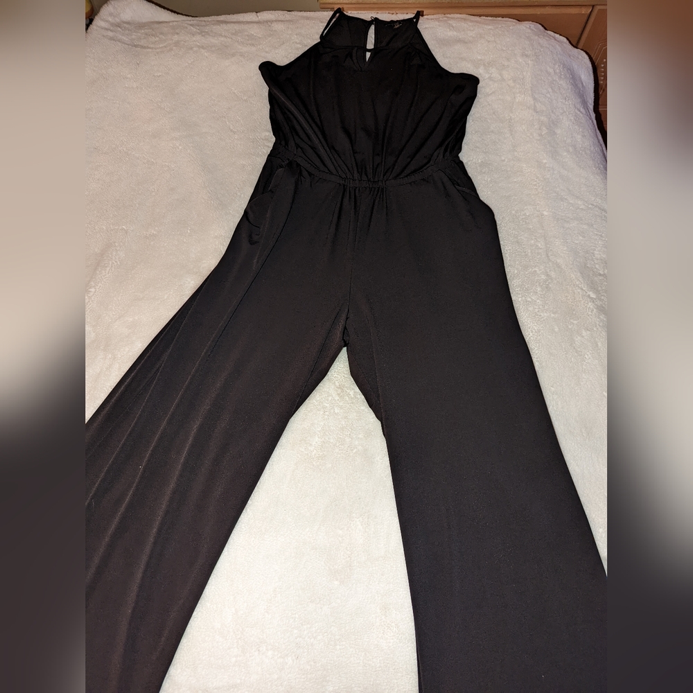 Black sleeveless jump suit .. wide pants size large